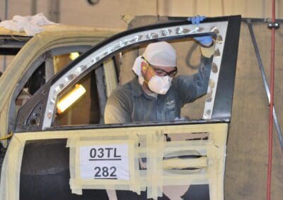 Person working on car side door