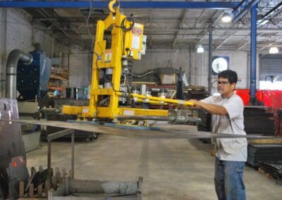 Person working on the metal sheet