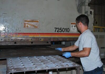 Person working with Hydraulic Press Brake